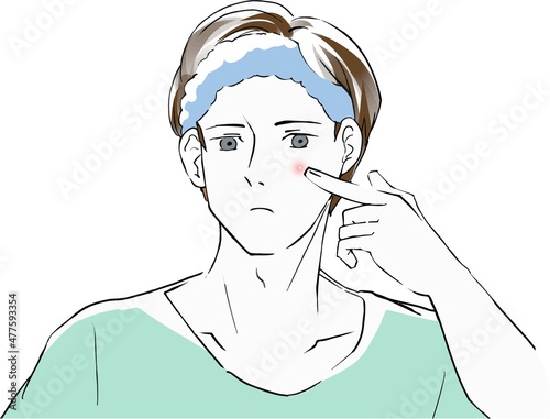 にきびを気にする若い男性