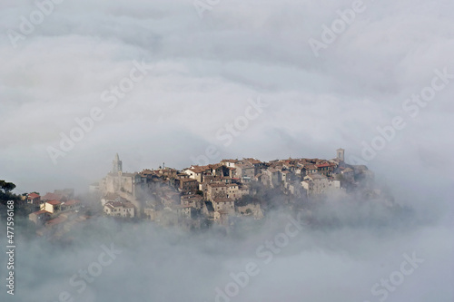 village emerges from the fog
