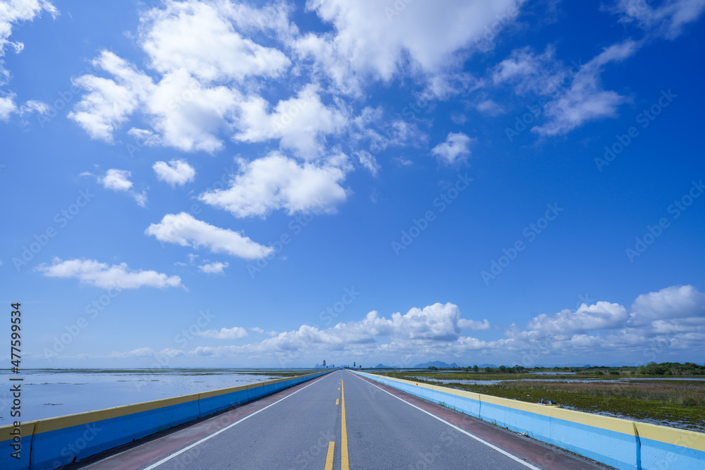 Fototapeta premium An empty road with sky and clouds.