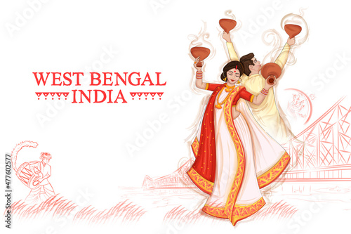 couple performing Dhunuchi dance traditional folk dance of West Bengal, India