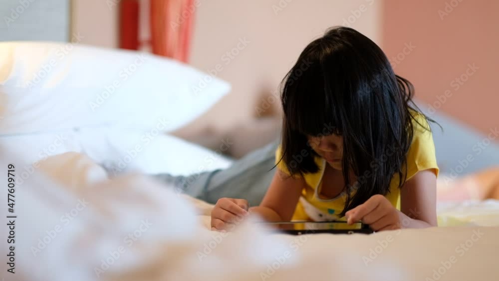 kid watching tablet on the bed, child addicted cartoon
kid watching tablet on the bed, child addicted cartoon