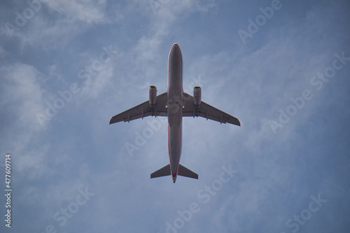 flying airplane photographed from below