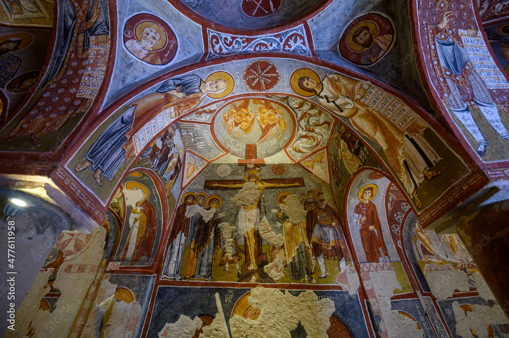 Frescos and murals in ancient cave Apple Church or Elmali Kilise painted in directly onto rock, Goreme, Cappadocia, Turkey