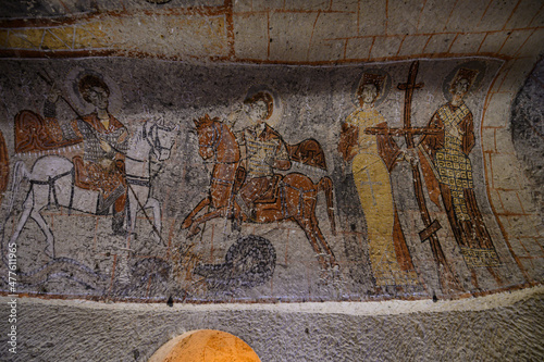 Frescos and murals in ancient cave church in Goreme, Cappadocia, Turkey painted in directly onto rock