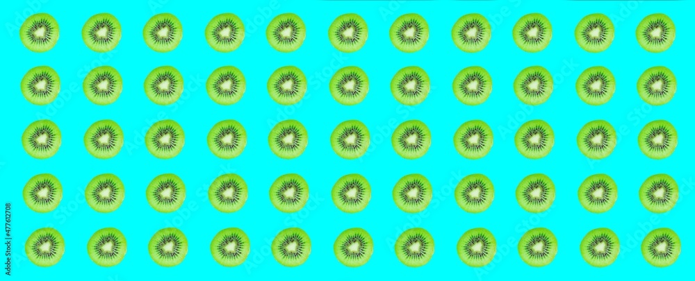 Kiwi slices pattern, top view of kiwi slices on colorful background.
