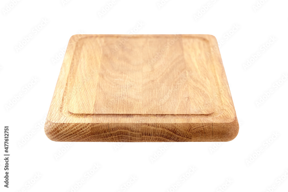 Wooden chopping or serving board with juice gutter isolated on white Wooden chopping or serving board with juice gutter isolated on white