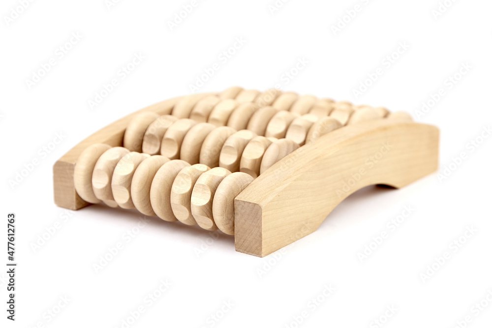 Wooden foot massage roller isolated on white Wooden foot massage roller isolated on white
