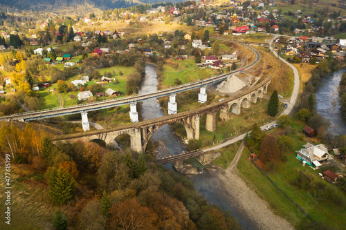Aerial view of bridges and village on autumn day