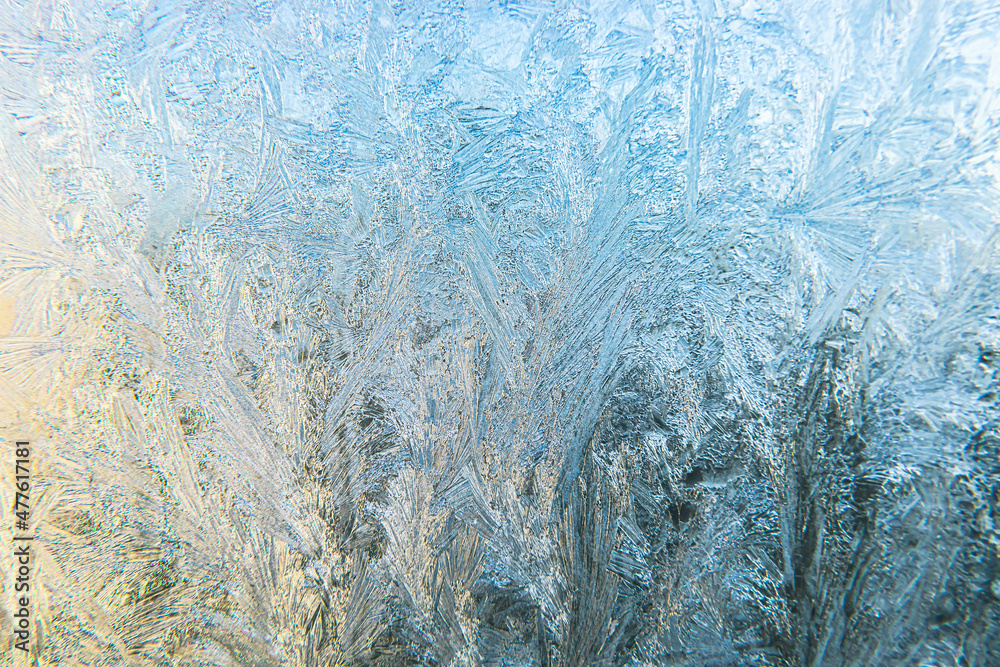 Frozen winter window with shiny ice frost pattern texture. Christmas wonder symbol, abstract background. Extreme north low temperature, natural Ice snow on frosty glass, cool winter weather outdoor Frozen winter window with shiny ice frost pattern texture. Christmas wonder symbol, abstract background. Extreme north low temperature, natural Ice snow on frosty glass, cool winter weather outdoor