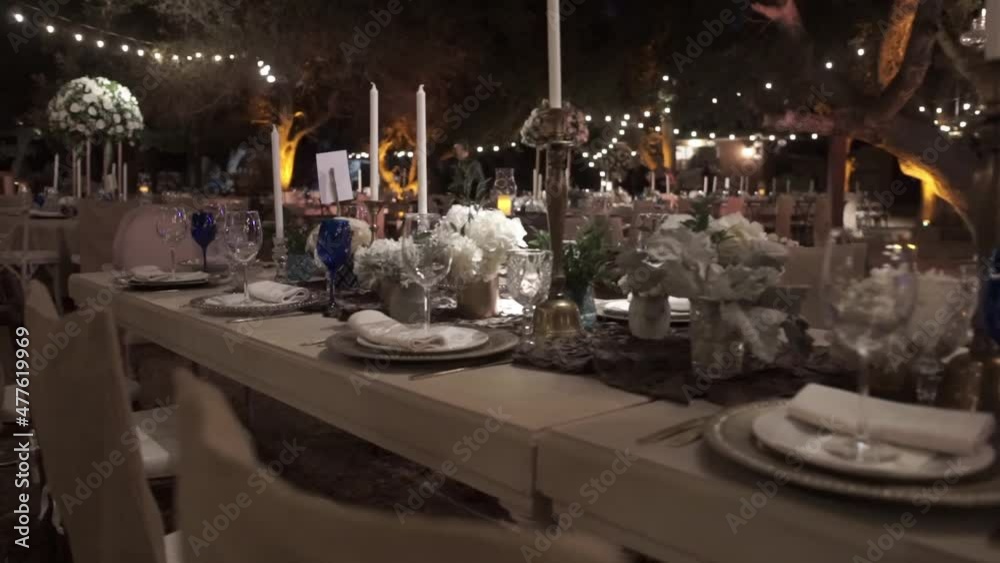 Dolly of an elegant table set up with cutlery and plates. Dolly of an elegant table set up with cutlery and plates.