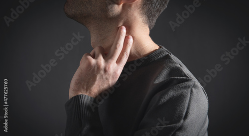 Quadro em tela Caucasian man checking pulse at home.