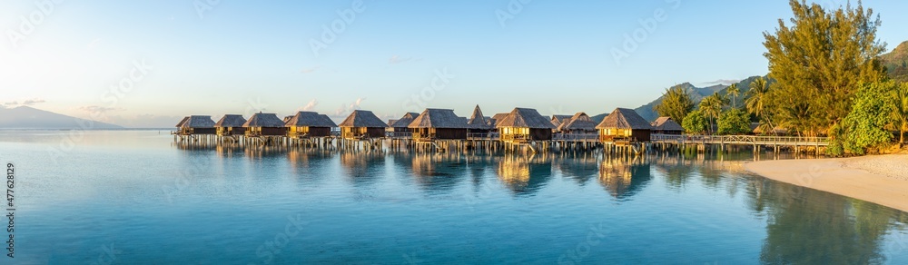 Overwater bungalows at a luxury beach resort on Moorea island, French Polynesia Overwater bungalows at a luxury beach resort on Moorea island, French Polynesia