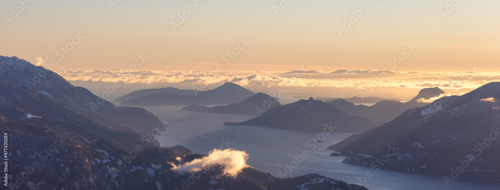 Aerial Panoramic View of Howe Sound, Islands and Canadian Mountain Landscape on the West Coast of Pacific Ocean. Located near Squamish and Vancouver, British Columbia, Canada. Winter Sunset - obrazy, fototapety, plakaty 