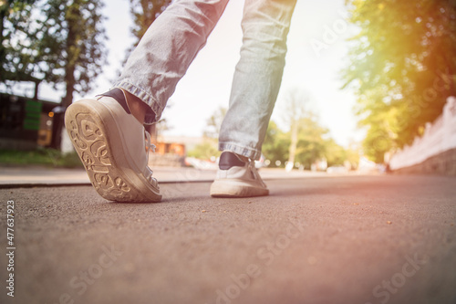 close-up of sneakers shoes walking on the way