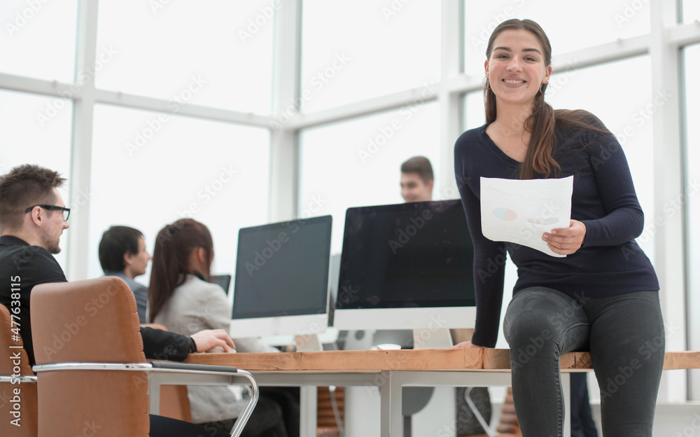 young employee with documents sitting on the office Desk young employee with documents sitting on the office Desk