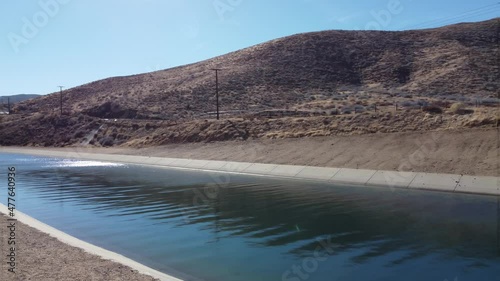 California Aqua Duct in Palmdale California on Sunny Blue Sky Day with Full Water in Desert photo