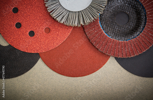 Big set of abrasive tools and sandpaper used for cleaning or grinding products. Industrial tools. photo