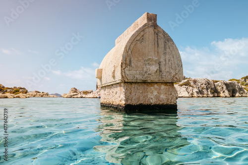 Ancient sunken tomb of the Lycian Greek civilization on the shores of the Mediterranean Sea near the island of Kekova in Turkey. Travel attractions and wonders photo