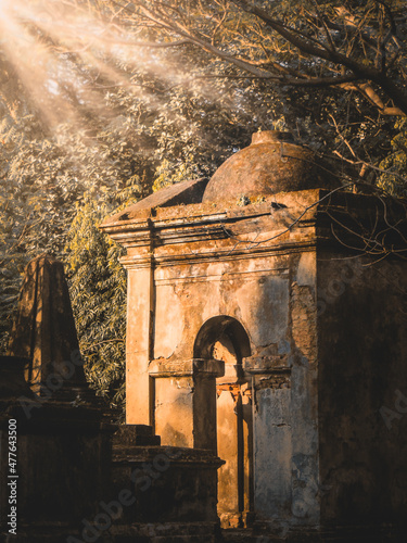 Cemetery sculpture in sunrays