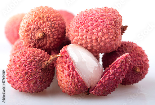 Lychee with peel and peeled lychee isolated on a white background photo