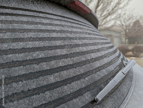 Rear window of SUV being defrosted 