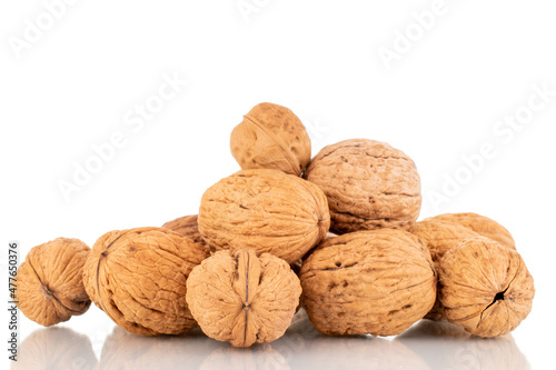 Several ripe walnuts, close-up, isolated on white.