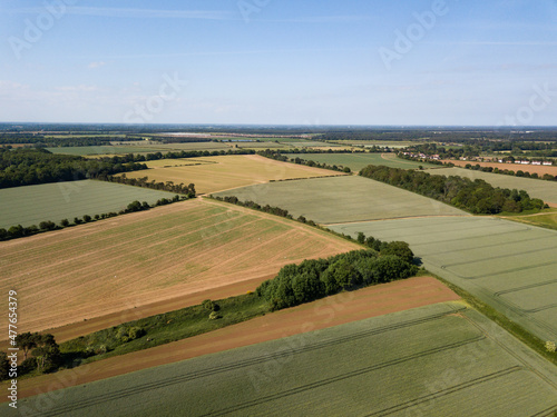 Aerial view of a patchwork of farm fields in the Suffolk countryside
