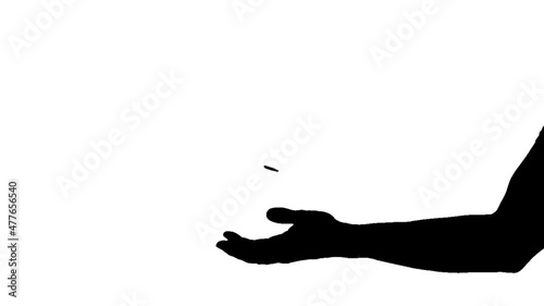 Man's hand throwing up a coin to make a decision on white background photo