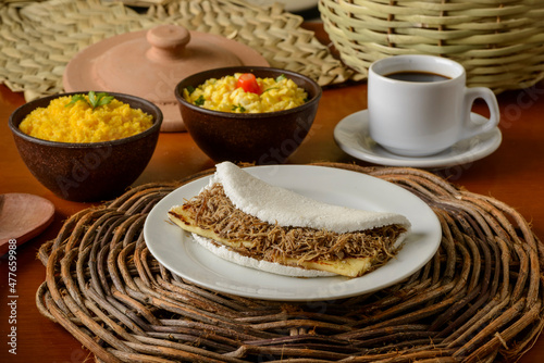 Sun meat tapioca and curd cheese, with eggs and couscous. Typical Brazilian Northeast breakfast. © Cacio Murilo