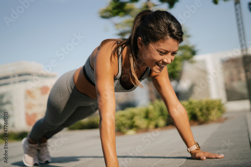 Beautiful athlete woman in sportswear outdoors. Young woman training in the park. Healthy lifestyle...