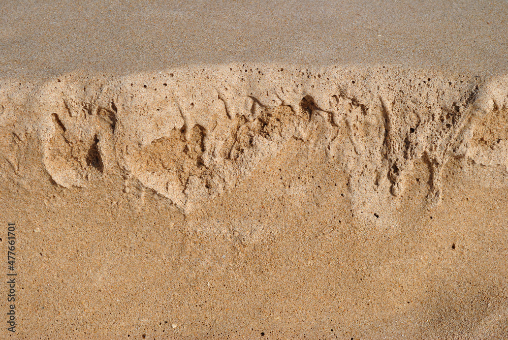 Fototapeta premium Close Up of Textured Eroded Sand on Sunny Beach