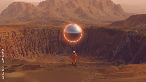 Fotografering Orange Spaceman Spacewoman With Large Alien Silver Sphere Crater Arid Desert Mou