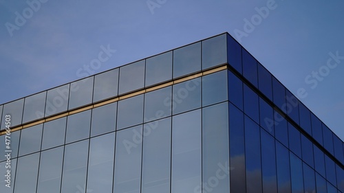 sky reflected in glass facade