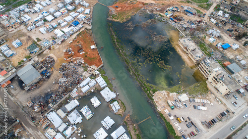 A Syrian refugee camp during a river flood in the Lebanese Bekaa Valley photo