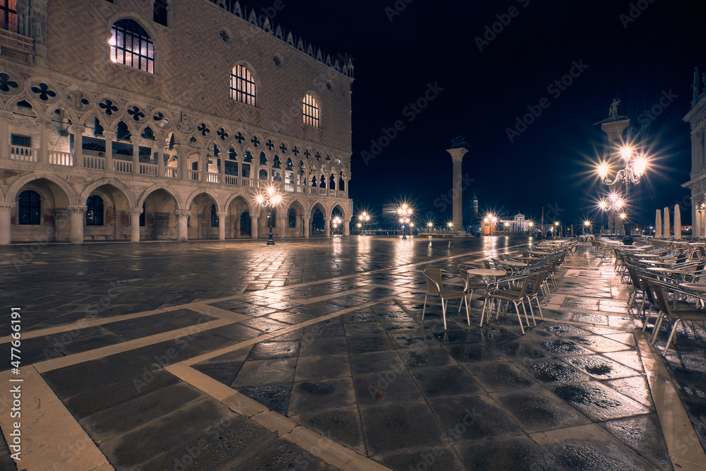 San Marco square in Venice at night, monochromatic sepia look from electric illumination and light from street lamps.