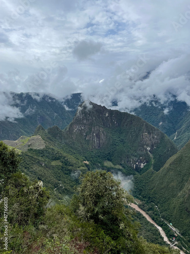 Views of Macchu Pichu through the mist and the surrounding mountains, Peru