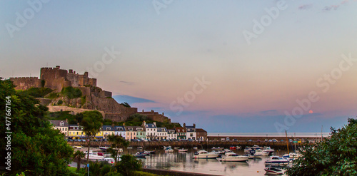 A castle on a hill with a harbour in front © eclbirkeland