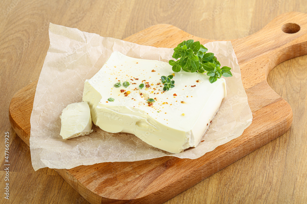 Greek Feta cheese over board