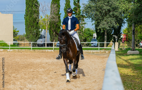 Riding a horse in competition