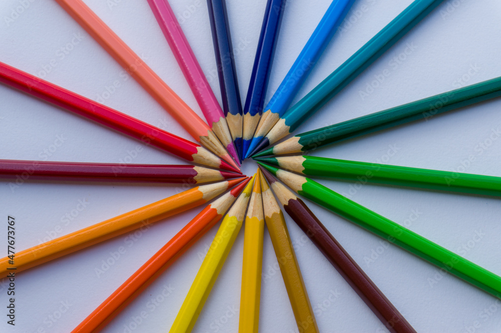 several colored pencils forming a circle