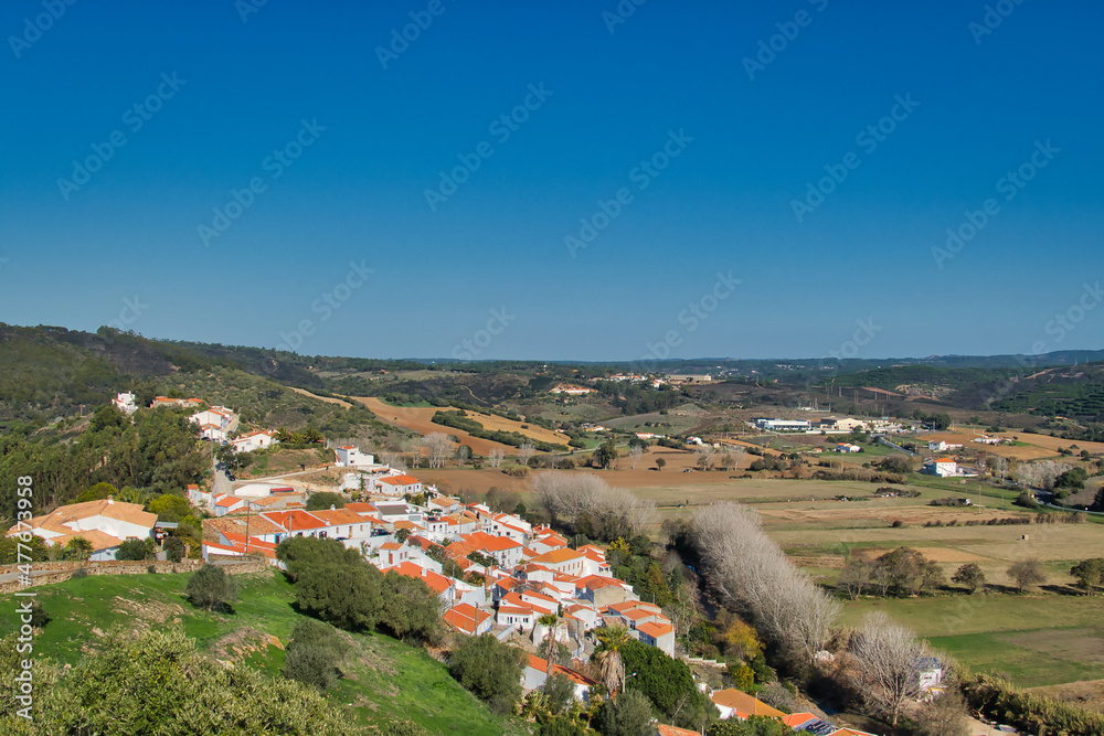 View from above of the old town of Aljezur, the river Ribeira do Algribe, and surrounding farmland, Algarve, Portugal
