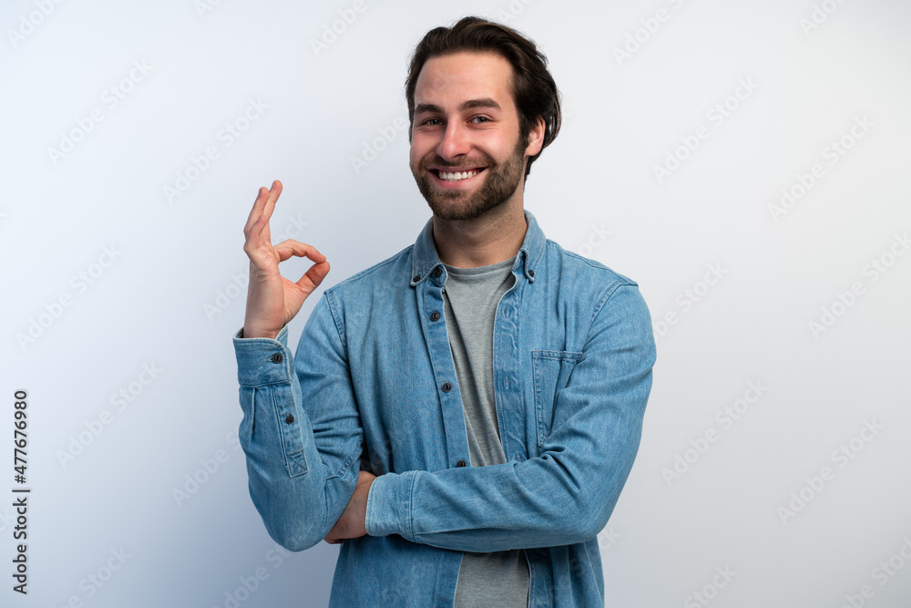 Everything is fine. Satisfied bearded man showing ok gesture with fingers, approving work Everything is fine. Satisfied bearded man showing ok gesture with fingers, approving work