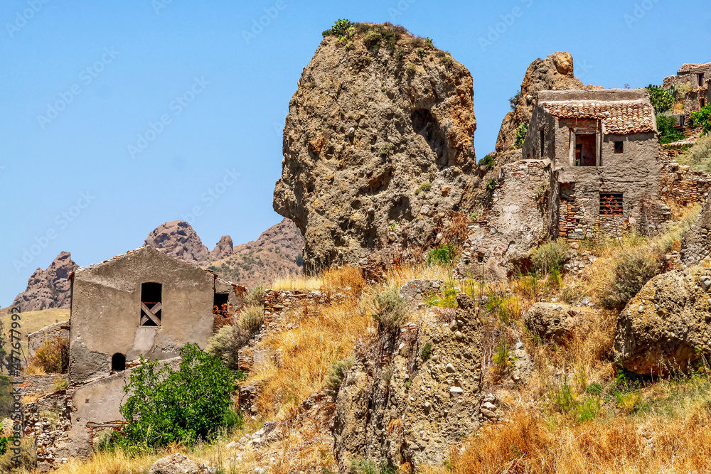 Small village of Pentedattilo, church and ruins of the abandoned village, Greek colony on Mount Calvario, whose form recalls the five fingers. Calabria, Italy