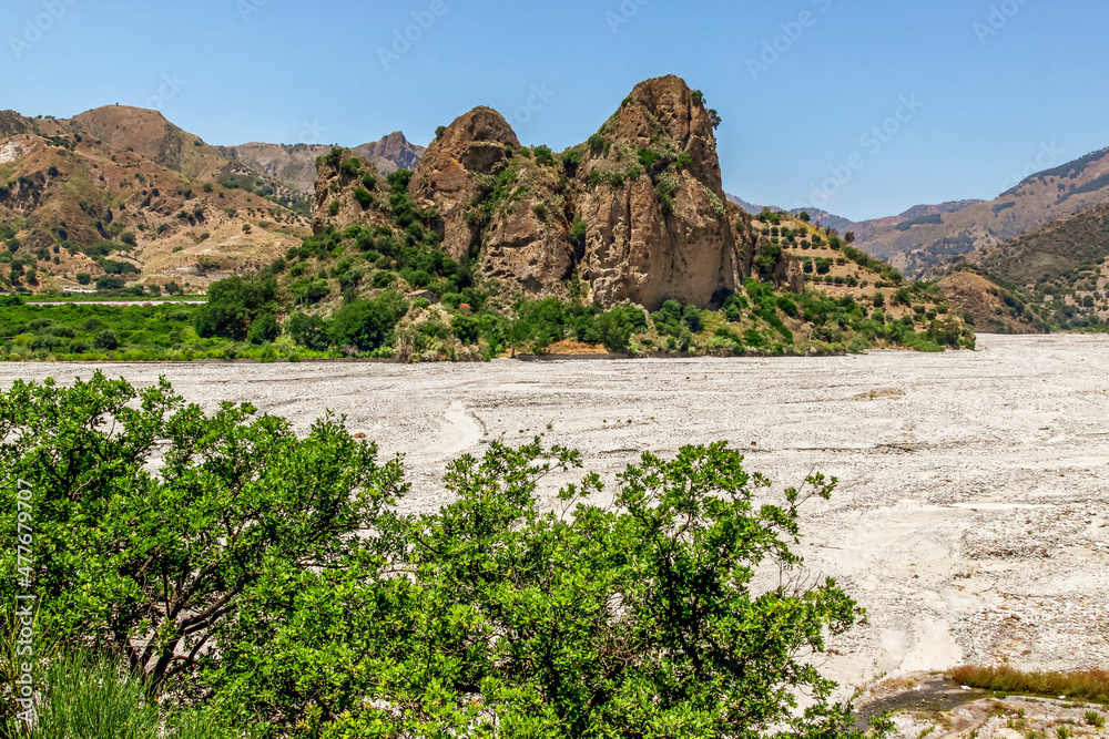 Wild landscape of Calabria. The Fiumara (river) of Amendolea in the Aspromonte National Park with bridge, Calabria, Italy