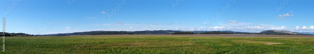 panoramic view of the river kent near arnside and sandside in cumbria with surrounding lakeland hills panoramic view of the river kent near arnside and sandside in cumbria with surrounding lakeland hills