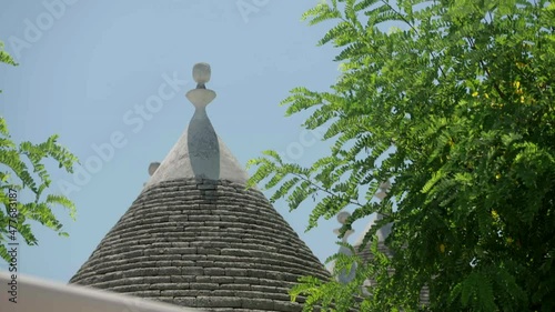 typical trulli of Alberobello surrounded by nature
 photo