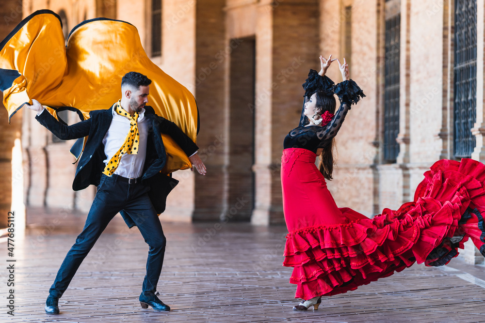 Fototapeta premium Man with a cloth dancing falmenco with a woman outdoors
