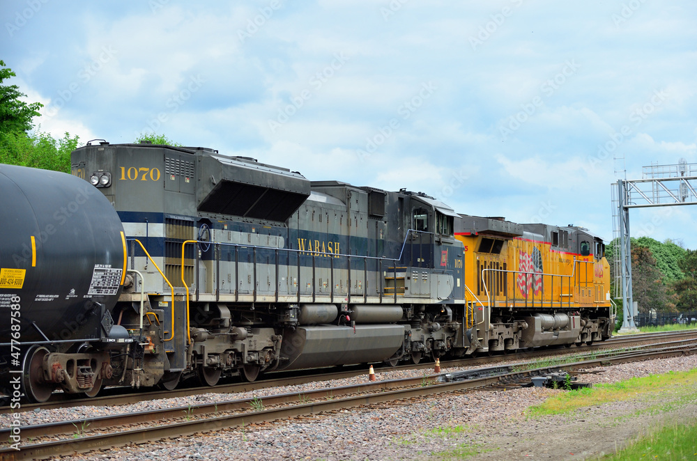 A Norfolk Southern Railway Locomotive In A Heritage Paint Scheme Helps Lead A Union Pacific Railroad Freight Train Toward Chicago The Unit Is Painted As A Tribute To The Wabash Railroad Stock