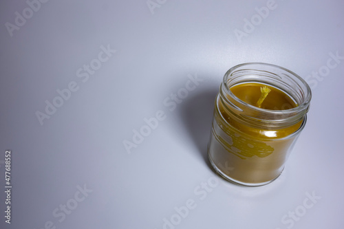 Bee candle in a glass with a wick