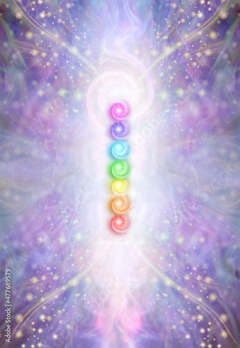 Seven Major Chakras and spiral energy field - beautiful sparkling ethereal purple energy with 7 rainbow coloured chakra energy vortexes place centrally and copy space all around for messages
 photo